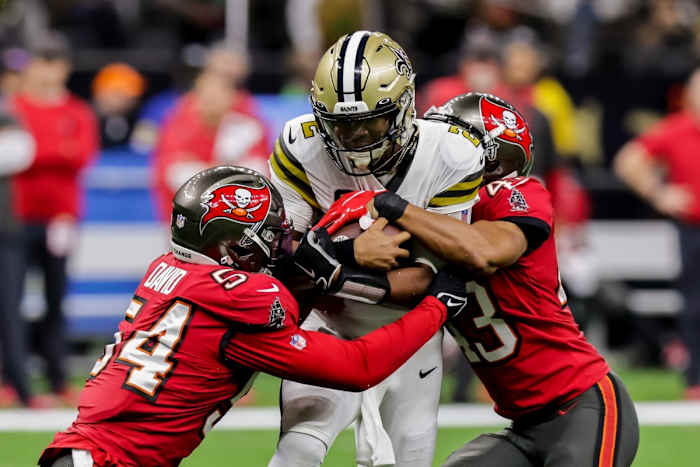 Tampa Bay linebacker Lavonte David (54) and cornerback Ross Cockrell (43) tackle Saints quarterback Jameis Winston (2). Mandatory Credit: Stephen Lew-USA TODAY Sports